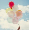 hand holding balloons