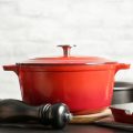 Cookware set: Red enameled cast iron pot, saucepan and bowls