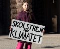 STOCKHOLM, SWEDEN - MARCH 22, 2019: 16-year-old Swedish climate activist Greta Thunberg demonstrating in Stockholm on Fridays. Holding a sign that says &#34;School strike for Climate&#34;.