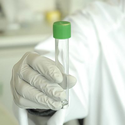 Chemist holding a test tube 