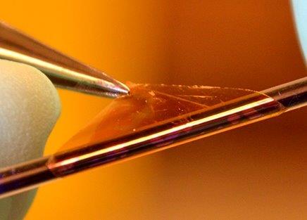 Macro of a transparent film wrapped around a thin pen